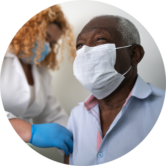 Man with mask getting a vaccine